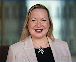 Headshot of Prof Carol Campbell, smiling and smartly dressed